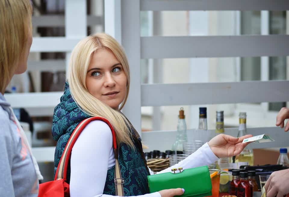 woman paying cash